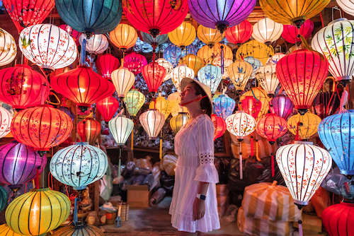 Travel,Woman,Choosing,Lanterns,In,Hoi,An,,Vietnam